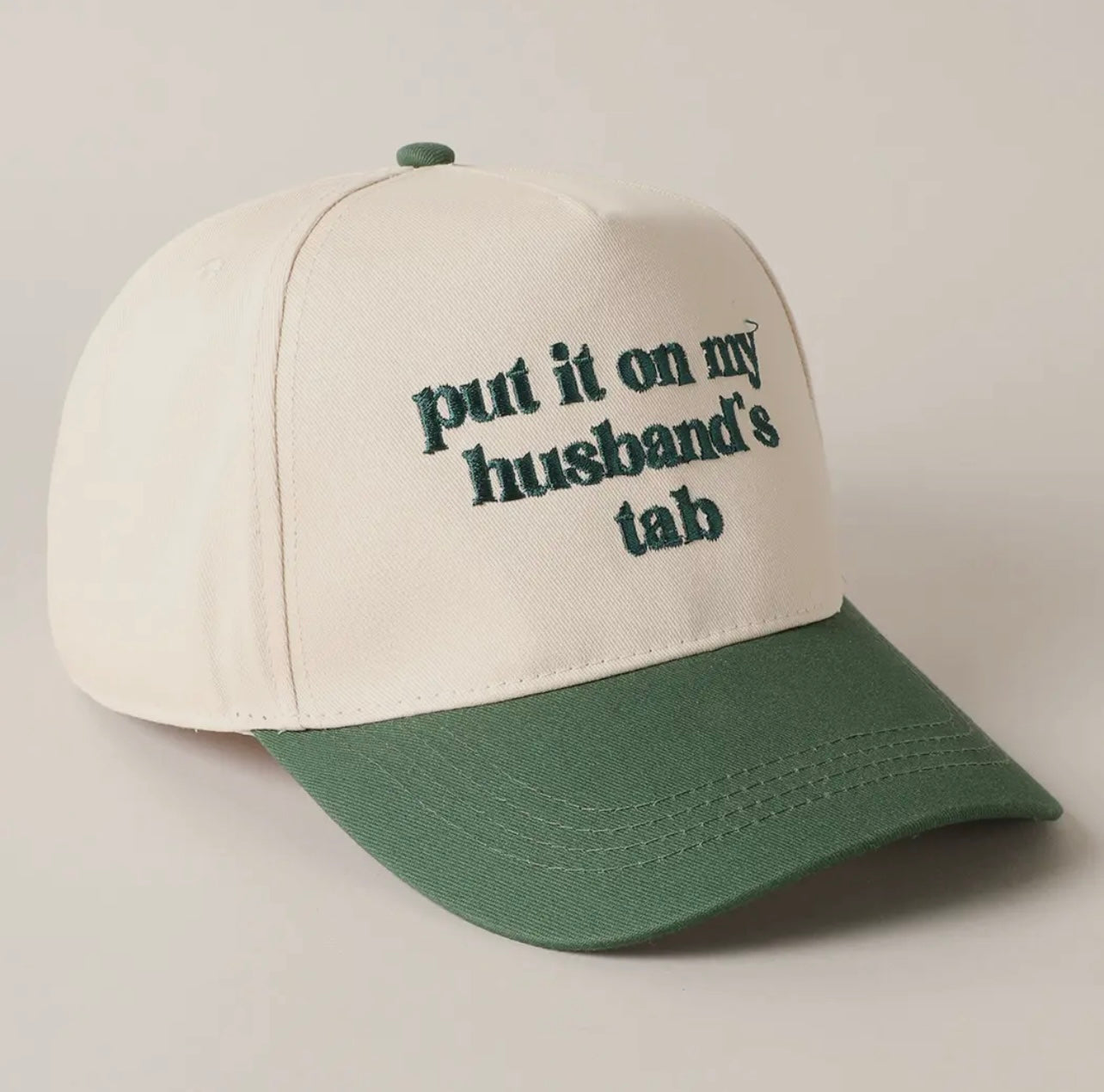 Put it on my Husbands Tab Trucker Hat